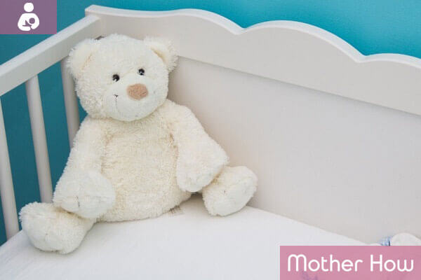 teddy-bear-on-baby-bed