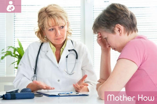 headache-pregnant-women-with-doctor
