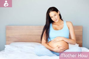 pregnant-women-sitting-on-bed