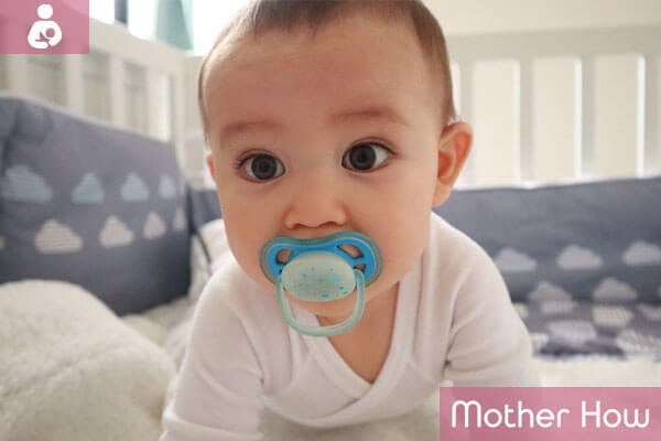 Cute-big-eyes-baby-with-pacifier