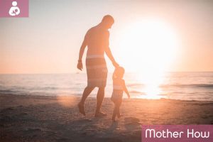 Father-and-baby-girl-early-morning-on-beach
