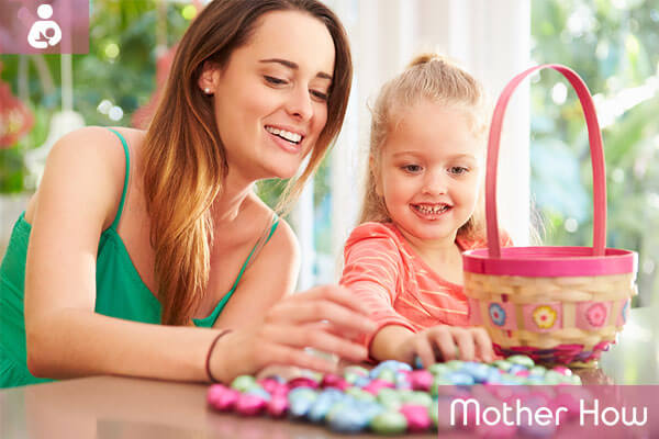 Mother-giving-sweets-to-daughter